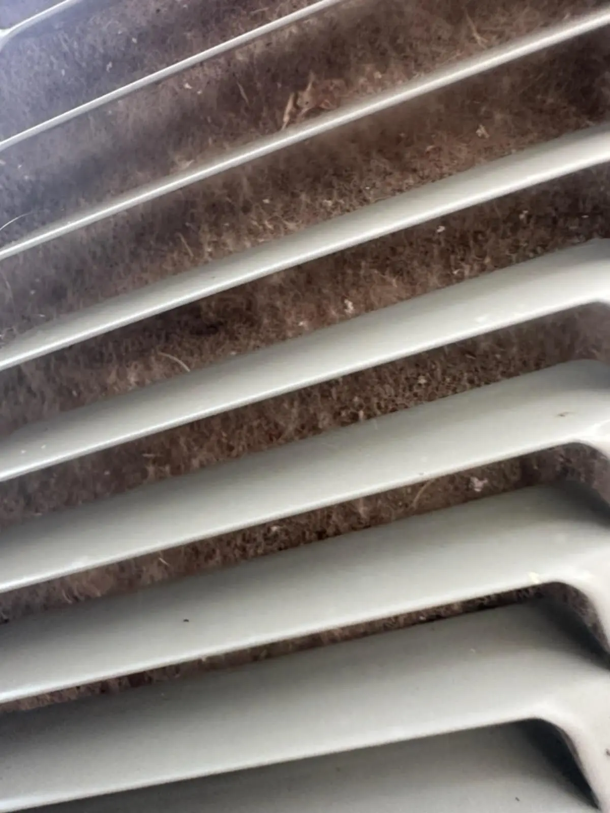 AC Maintenance Needed - Dirty Coils Claremore OK Dirty air conditioner condenser coil requiring professional AC maintenance in Claremore Oklahoma