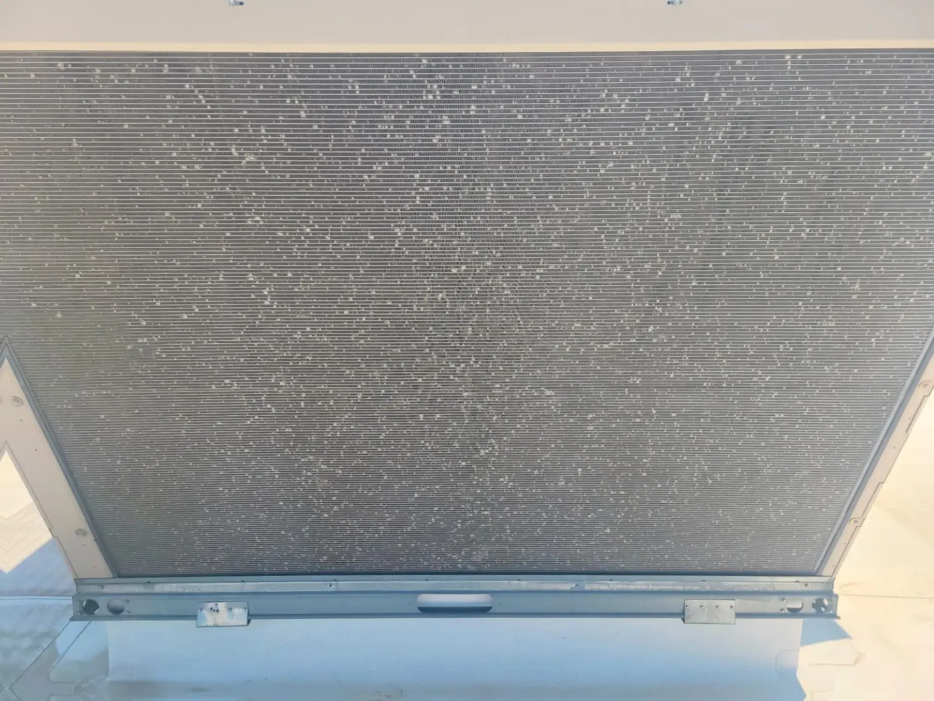 Hail Damage AC Repair Claremore Oklahoma Storm Damage Hail-damaged air conditioner condenser coil requiring emergency repair in Claremore Oklahoma