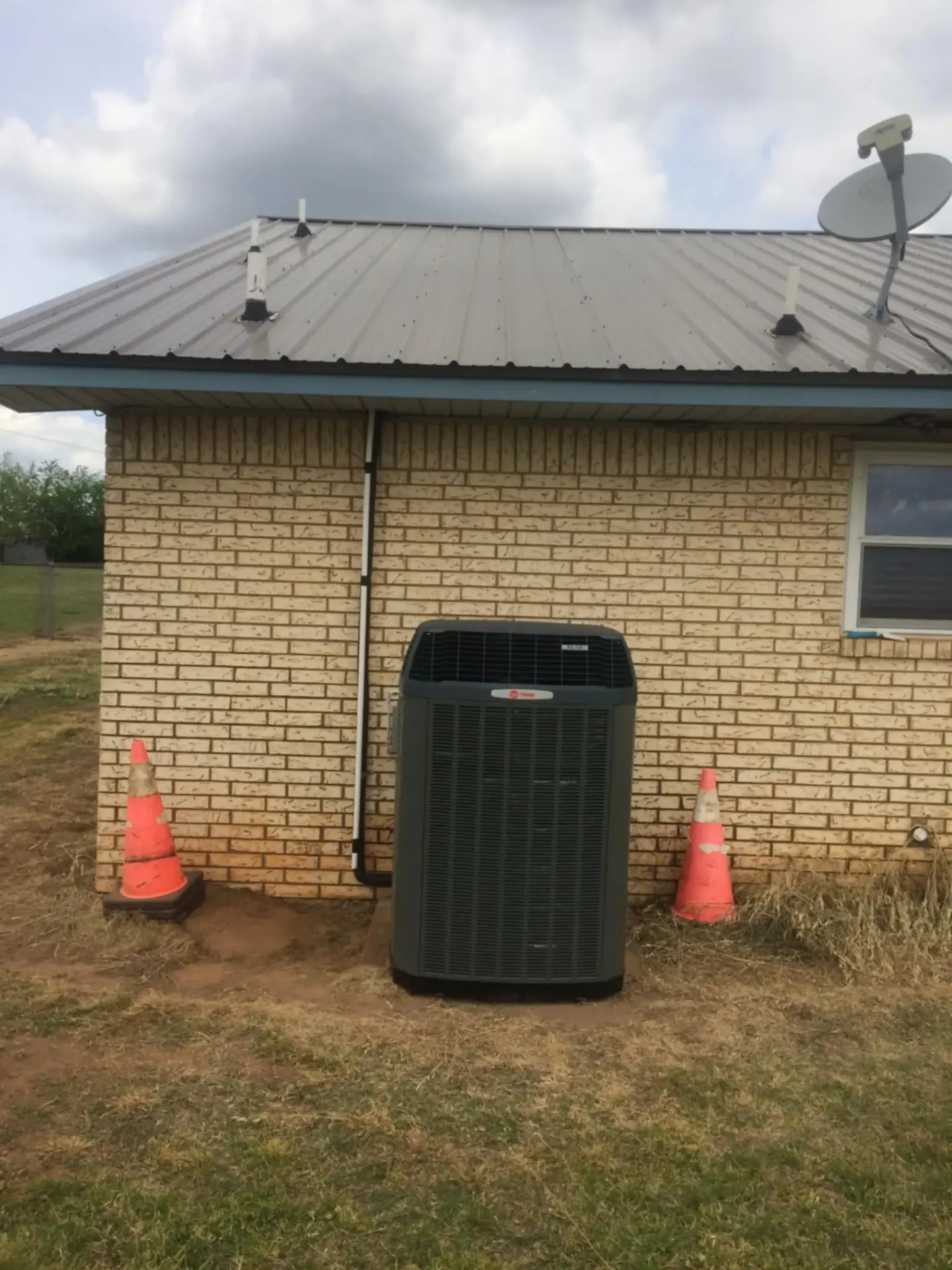 Heat pump outdoor unit installation for Claremore Oklahoma residential home