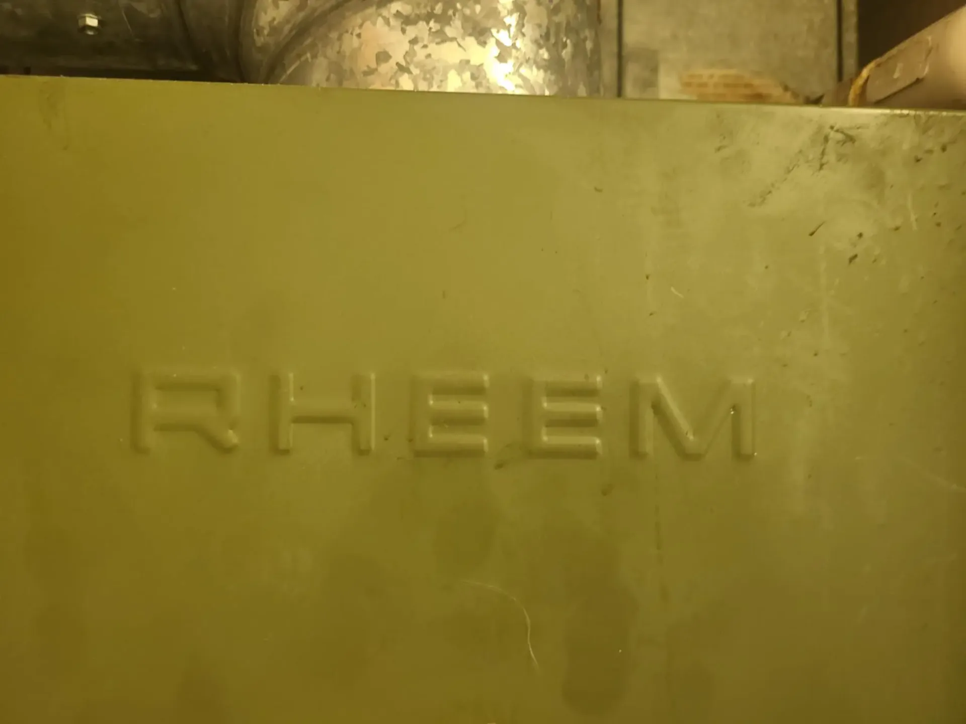 Aging Rheem furnace before heating system replacement in Claremore Oklahoma